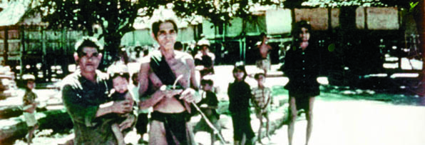 Mnong men, with their childern, volunteered to be trained by Paschall's Special Forces Detachment A-2 as village defenders in the fall of 1962. (Photo courtesy of Rod Paschall)