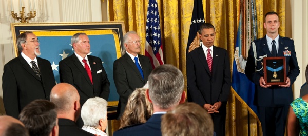 On Sept. 21, 2010, Etchberger's three sons (standing, at left) received the Medal of Honor from President Barack Obama in the East Room of the White House. (Defense Dept. Photo)