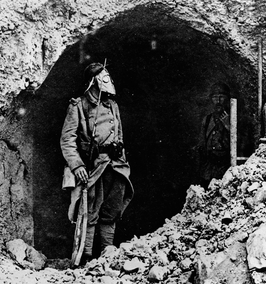 The Germans failed to follow up sufficiently to gain much advantage from their first chemical attacks, and it was not long before the Allies were developing measures of protecting their troops from them. Here, a French soldier in an early type of gas mask stands guard at his trench near Verdun in 1916. (National Archives)