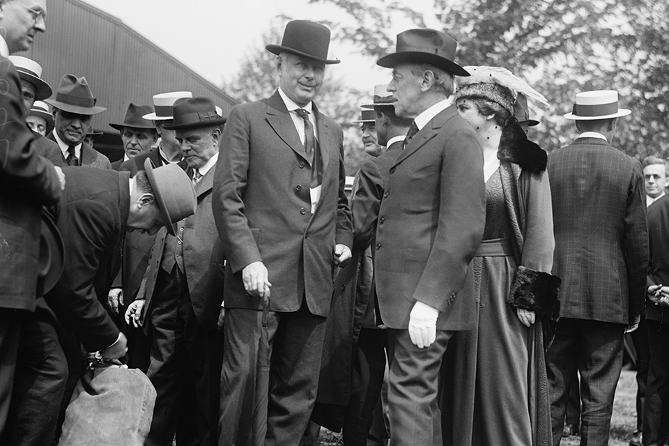 On hand for delivery at the Polo Grounds in Potomac Park, Washington D.C., were Postmaster General Albert Burleson and President Woodrow Wilson. (Library of Congress)