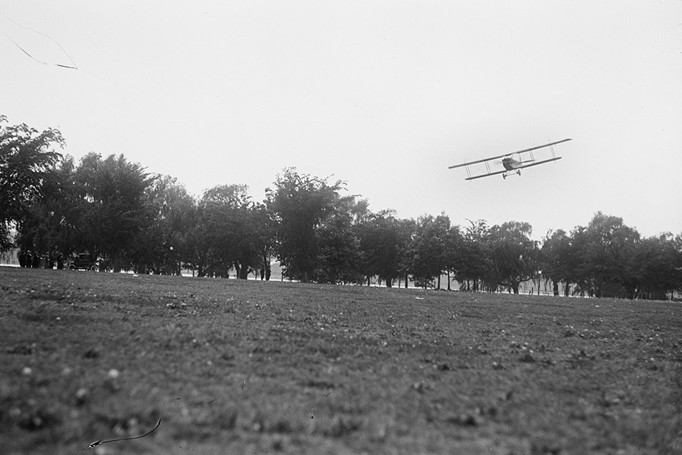 One of the airmail Jennys lands on the makeshift airfield on the Polo Grounds of Potomac Park. (Library of Congress)