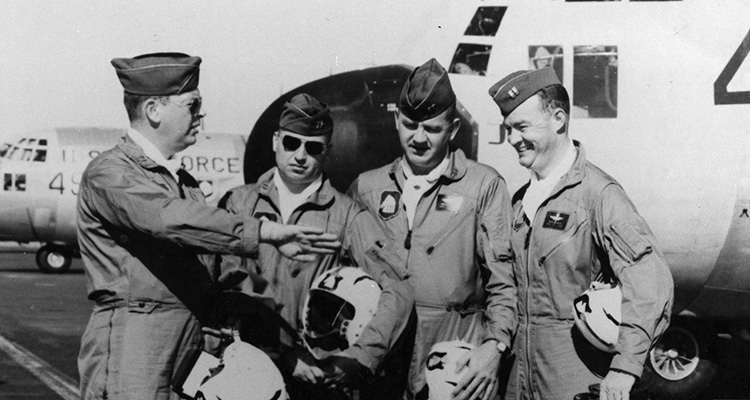 The original Four Horsemen, Gene Chaney, James Akin, David Moore and Bill Hatfield have a conversation amongst themselves in front of a C-130.
