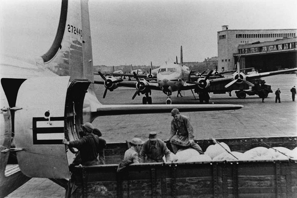 C-54 aircraft are unloaded at Templehof. Ground crews became adept at loading and unloading aircraft in mere minutes. (U.S. Air Force)