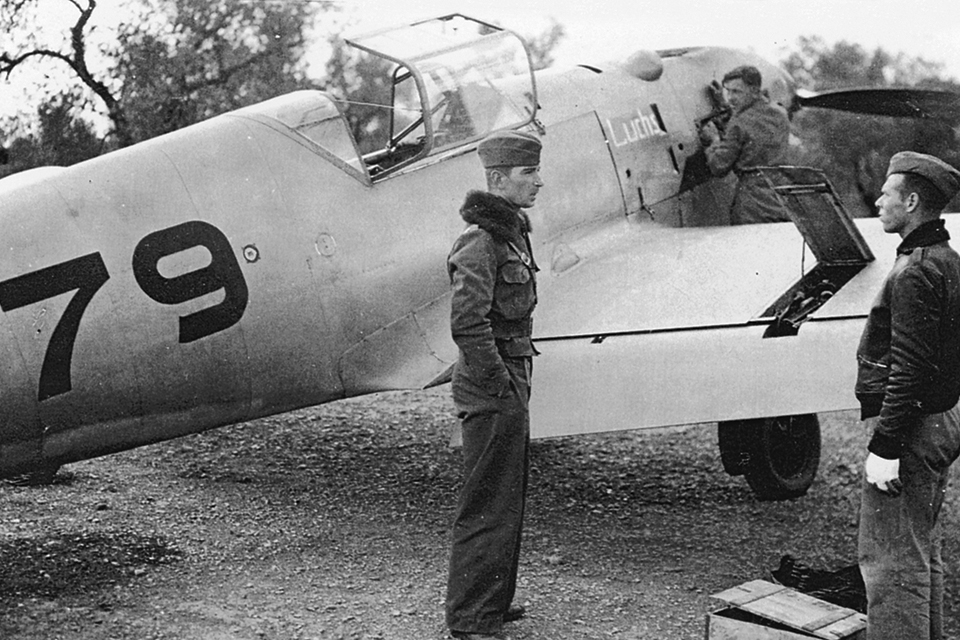 Werner Mölders, shown beside his Bf-109D-2, introduced the “finger-four formation” over Spain and became the leading Condor Legion ace, with 14 victories. (Walter A. Musciano collection)
