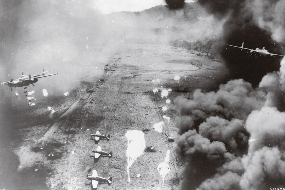 This combat photo, taken by a rear-facing camera ­installed on one of the 345th Bomb Group’s bombers, captures Mitchells in the midst of a low-level attack on the Dagua airfield. (National Archives)