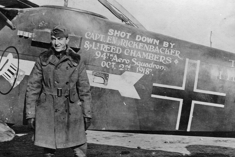 “Capt. Eddie” poses beside the Halberstadt observation airplane that he and fellow squadronmate Reed Chambers, forced down on October 2, 1918. (National Archives)