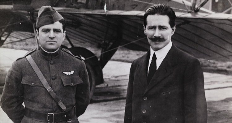 U.S. Representative—and future New York City Mayor—Fiorello LaGuardia took an unpaid leave of absence to organize the American aviators. He stands here next to the aircraft's Gianni Caproni.