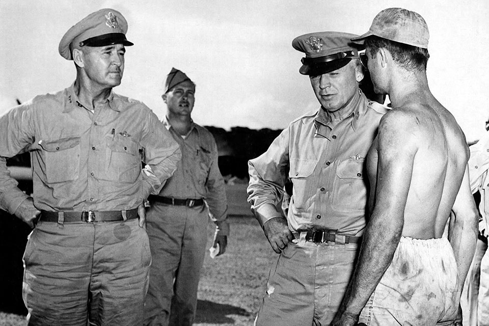 Gen. Arnold often toured the front to get his answers first hand. On Guam in 1945 the five star General talks with SSgt. Leo Fliess, while the commander of Army Air Forces in the Pacific, Gen. Barney Giles looks on. (U.S. Air Force)
