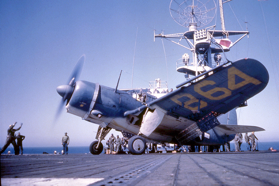 A Curtiss SB2C-4E Helldiver revs up its engine aboard an escort carrier in early 1945. By that time, the SB2C-4 model's 1,900-hp Wright R-2600-20 engine provided the powerthe dive bomber needed to takeoff and land on relatively small vessels. (PhotoQuest/Getty Images)
