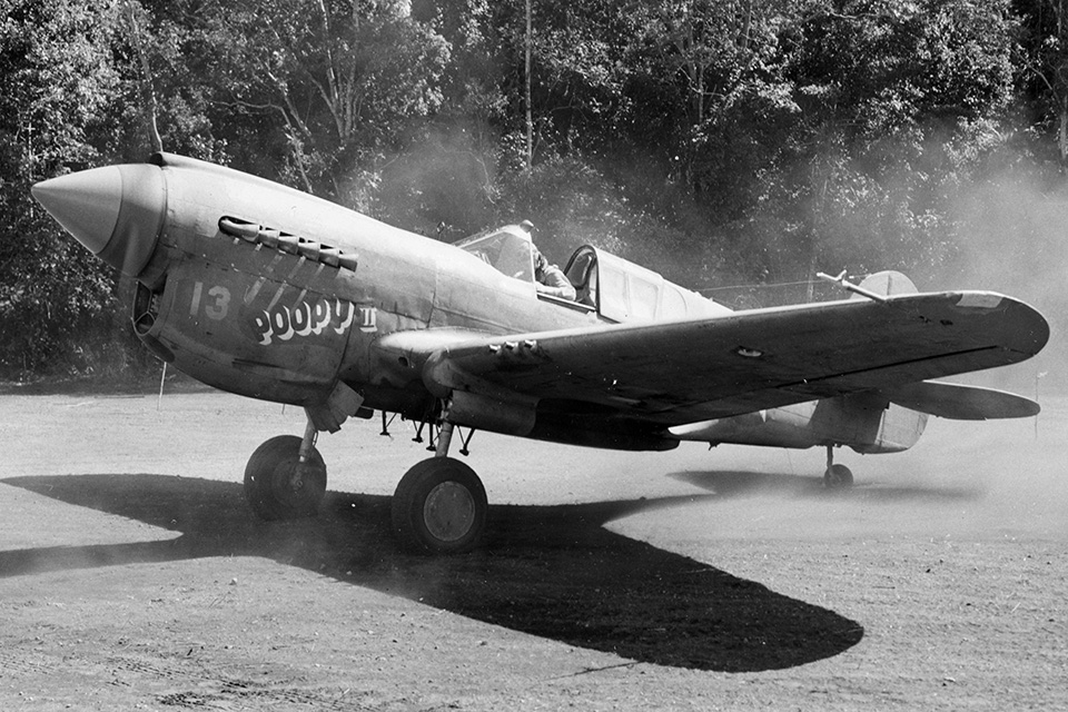This P-40E is ready for takeoff from Dobodura, New Guinea, in May 1943. "Poopy II" was flown by five-victory ace 1st Lt. A.T. House, Jr. from the 49th Fighter Group. (National Archives)