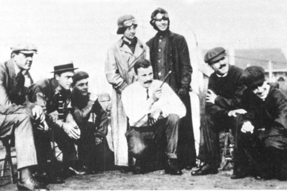 The Moisant Aviation School on Long Island, New York. Matilde Moisant and Quimby stand behind instructor Andre Houpert. (New York Public Library)