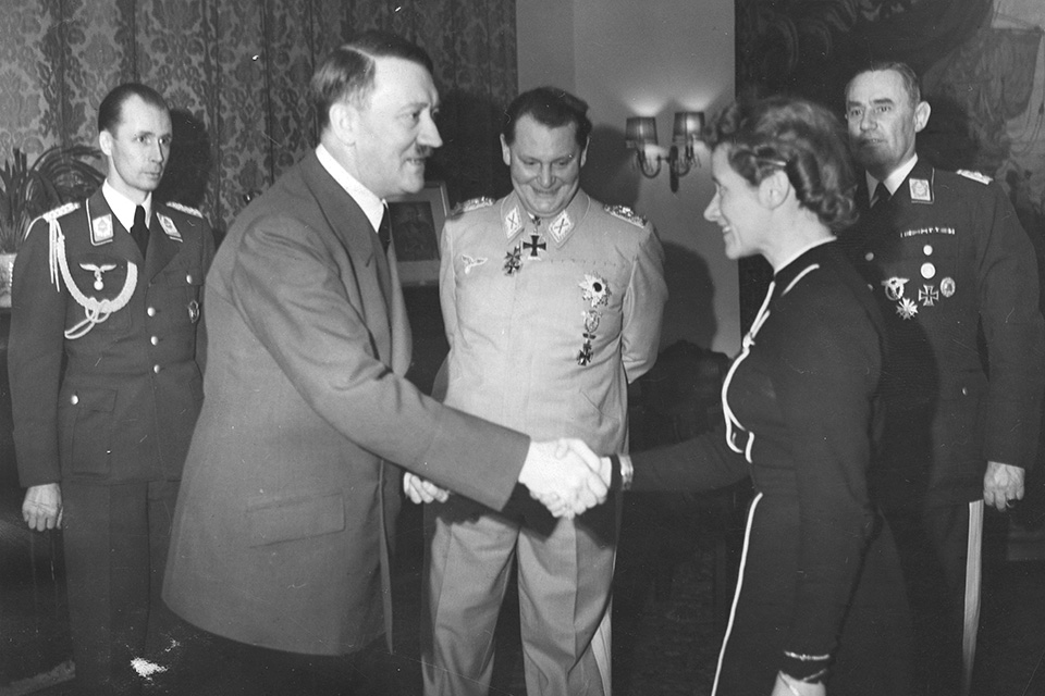 On March 28, 1941, Adolf Hitler presents the Iron Cross Second Class to Hanna Reitsch for her service to Germany as a test pilot. (Getty Images)