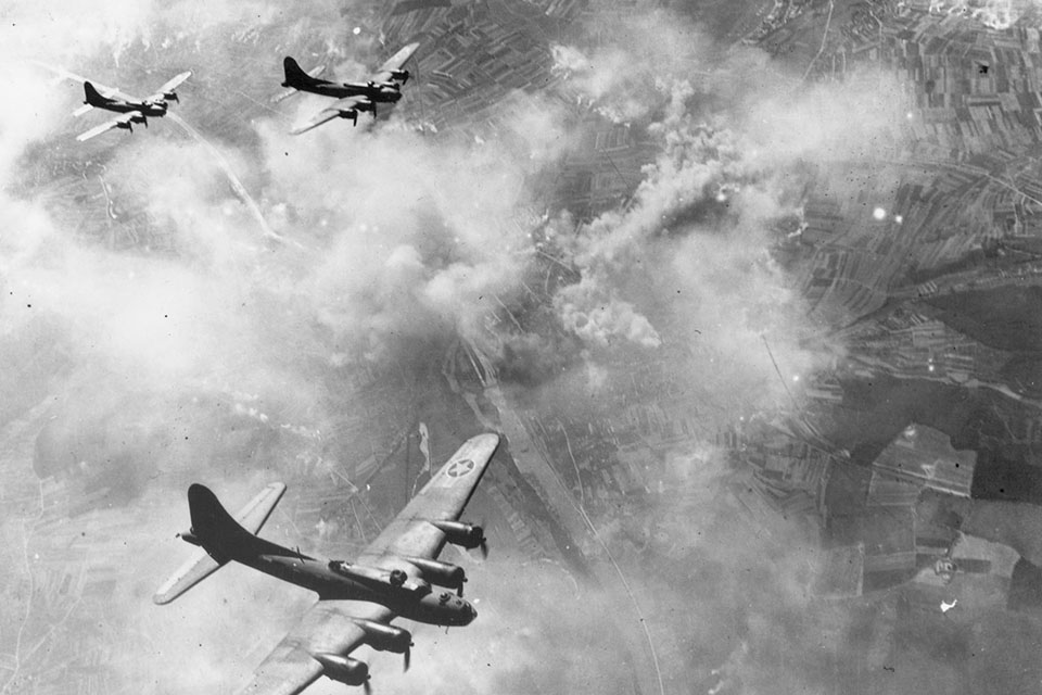 B-17Fs hold their formation over an already-burning Schweinfurt. The Eighth Air Force dropped a total of 485 tons of high-explosive and 88 tons of incendiary bombs on the city’s ball-bearing manufacturing plants. (National Archives)