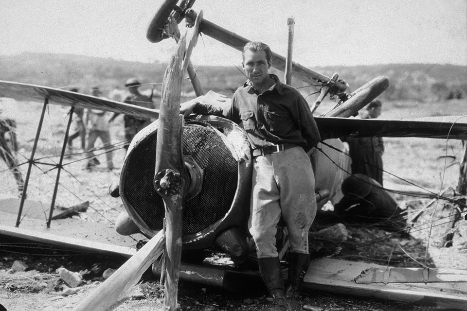 Stunt pilot Dick Grace stands next to the airplane he crashed, in director William A. Wellman's film "Wings." (HistoryNet Archives)