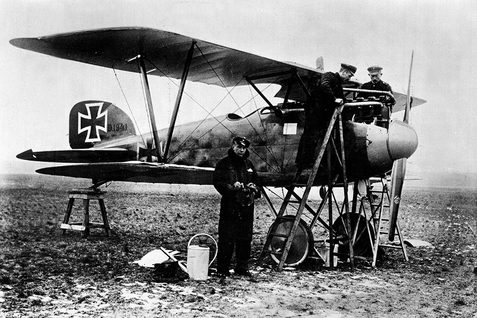 Newly promoted Leutnant der Reserve Udet waits for his mechanics to pour boiling water into the radiator of his Albatros D.III, 1941/16, before taking off from Jasta 15’s airfield at Habsheim in January 1917. After landing the radiator was drained to keep it from freezing in the radiator. (Roger Viollet via Getty Images)
