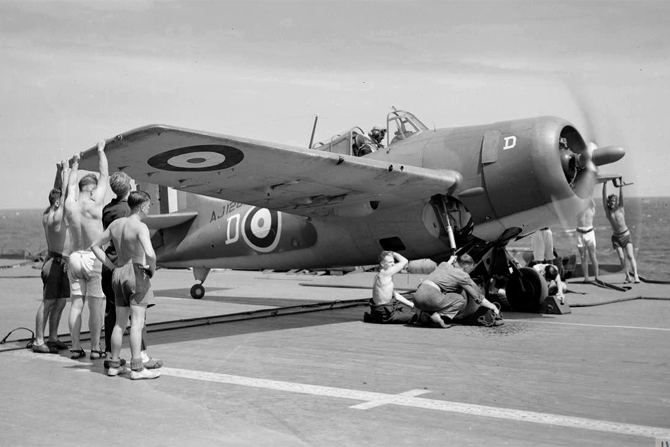 For its combat debut the barrel-chested fighter wore the markings of Britain's Royal Navy. This "Martlet" (The British nickname) is prepped for launch from the Royal Navy carrier HMS Formidable. (IWM A 11640)