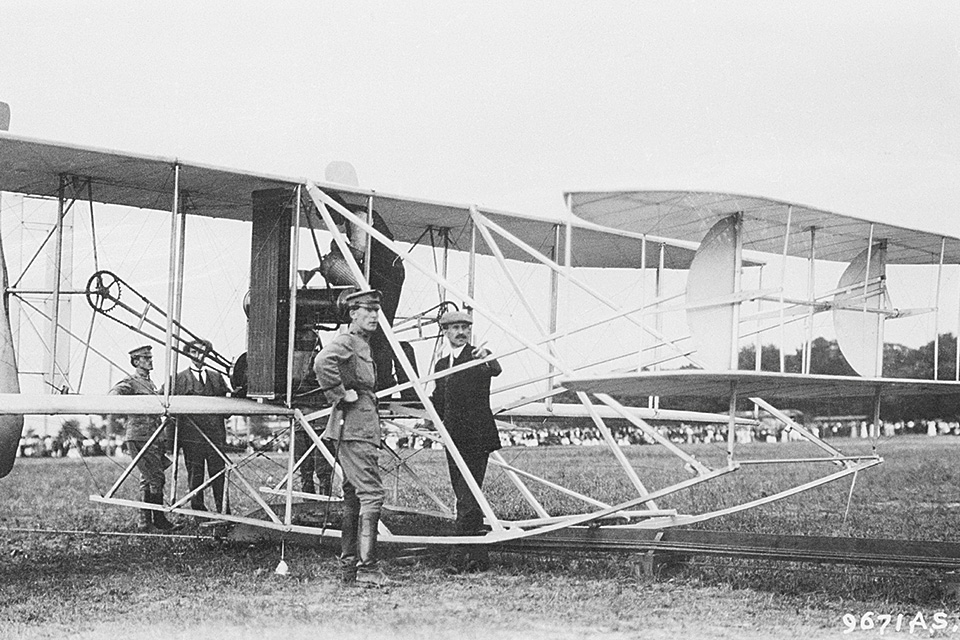 The Wright Military Flyer is being prepared for testing in this photo, which shows (from left) Army Lieutenant Benjamin D. Foulois, Wilbur Wright, Lieutenant Frank P. Lahm and Orville Wright. (National Archives)
