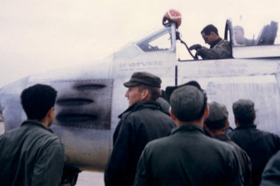 With telltale gun gas residue showing that his machine guns have been fired, Captain Jabara draws a crowd after returning from his historic May 20, 1951 mission. (U.S. Air Force)
