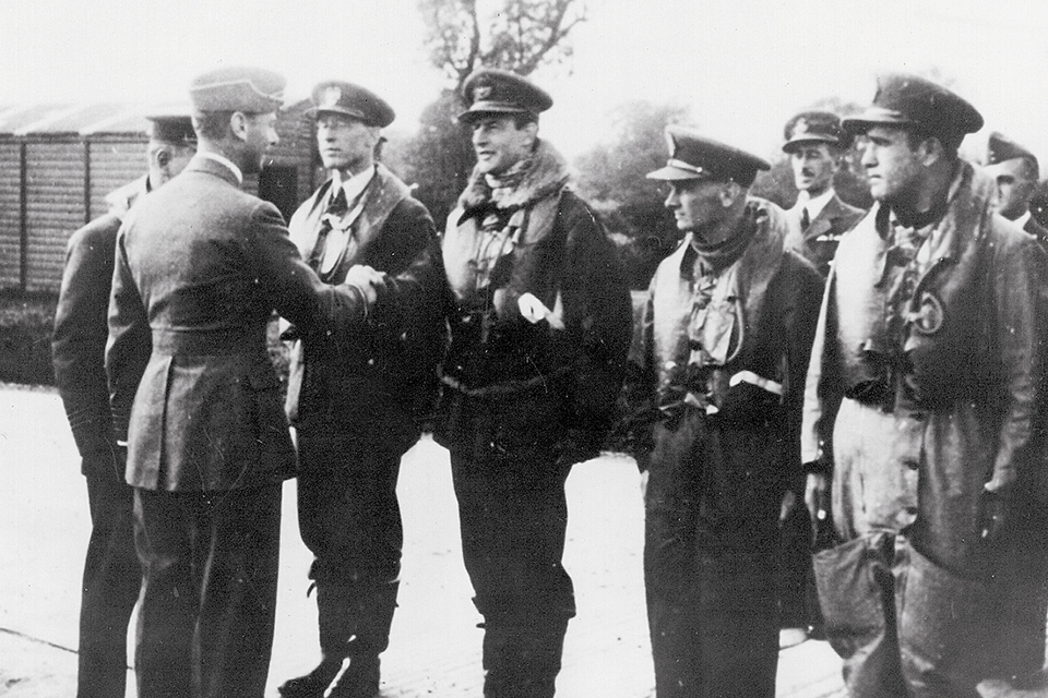 On September 26, King George VI congratulates (from left) Witold Urbanowicz, Atholl Forbes, Ludwik Paszkiewicz (KIA the next day) and Walerian Zak just before they took off on another mission. (HistoryNet Archives)