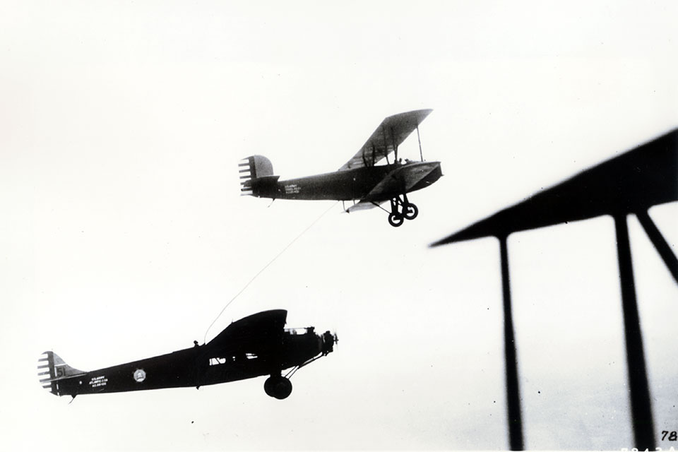 During the first week of January 1929, the Fokker C-2 endurance plane dubbed 'Question Mark' stayed aloft for just under 151 hours. Here it is being refueled from a Douglas C-1 transport. (USAF)