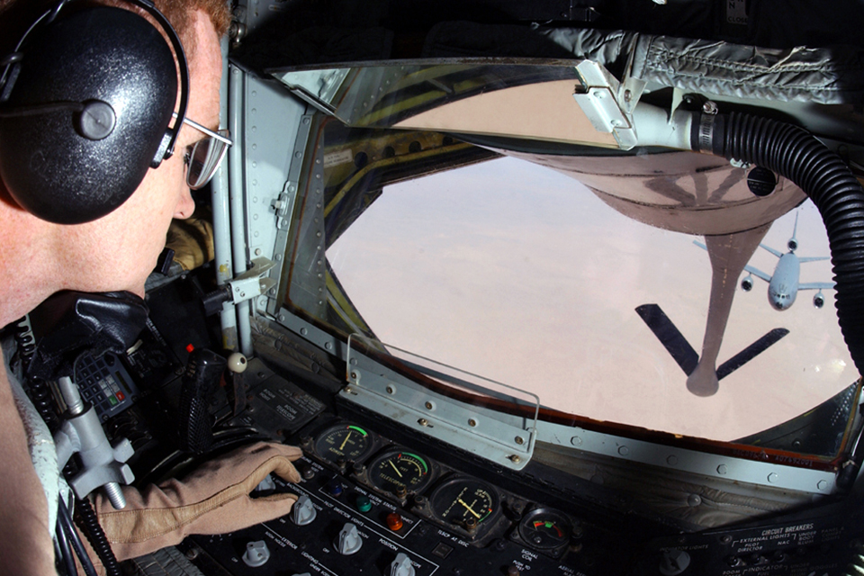 MSgt. Sam Blackwell, the boom operator on a KC-135 Stratotanker, prepares to transfer fuel to a KC-10 Extender. (U.S. Air Force)