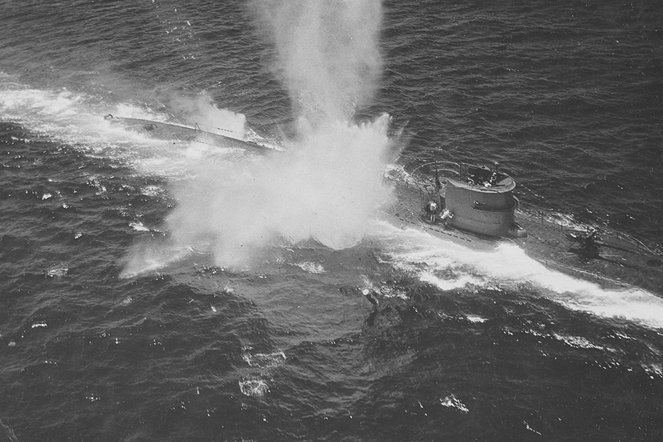 A German U-Boat under attack by aircraft from the USS Bogue (ACV 9). A number of men are seen crouching behind the conning tower for protection in the picture. (National Archives)