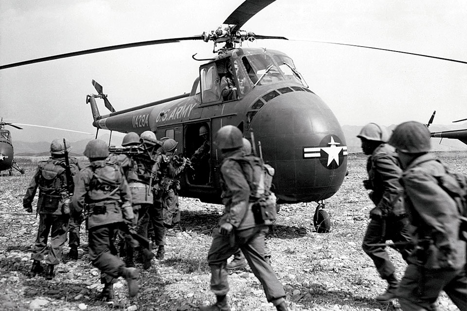 Troops of the U.S. Eighth Army board a Sikorsky UH-19D of the 6th Transportation Helicopter Company for a speedy ride to the front. The H-19 was the world’s first operational transport helicopter. (National Archives)