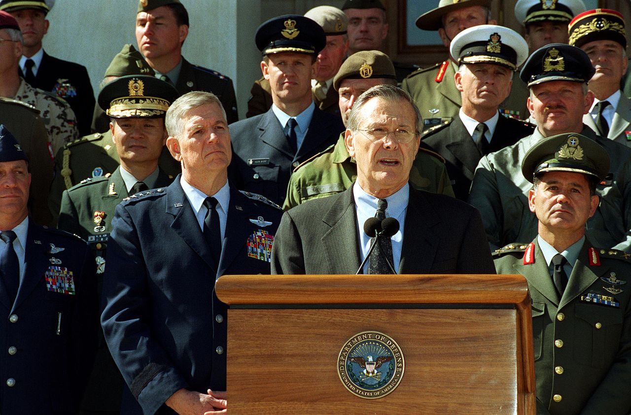 Secretary of Defense Donald Rumsfeld accompanied by Chairman of the Joint Chiefs of Staff General Richard B. Myers and joined by military representatives from 29 countries of the worldwide coalition on the war against terrorism, while speaking to the reporter outside The Pentagon on March 11, 2002.