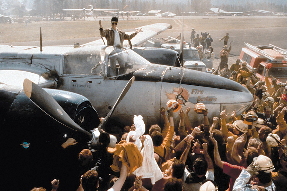A crowd of firefighters cheers Richard Dreyfuss in Always, which features spectacular footage of B-26 and PBY slurry bombers in action. (Art Resource)