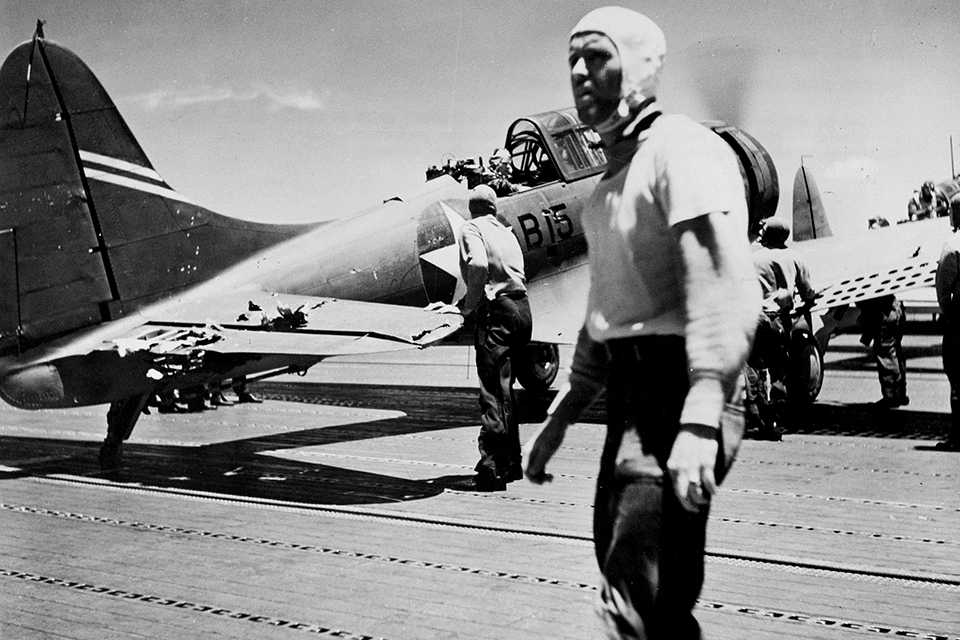 Damaged in the attack on the carrier Kaga, an SBD-3 of USS Enterprise’s Bombing Squadron Six (VB-6) recovers on the Yorktown. (National Archives)