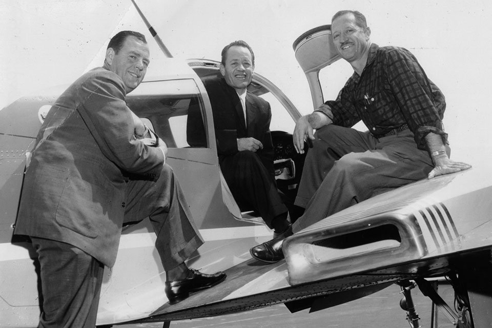 From left: Bob Prescott, president and founder of the Flying Tiger Line, poses with company pilots Greg Boyington and John R. "Dick" Rossi in 1952. (Flying Tigers Association)