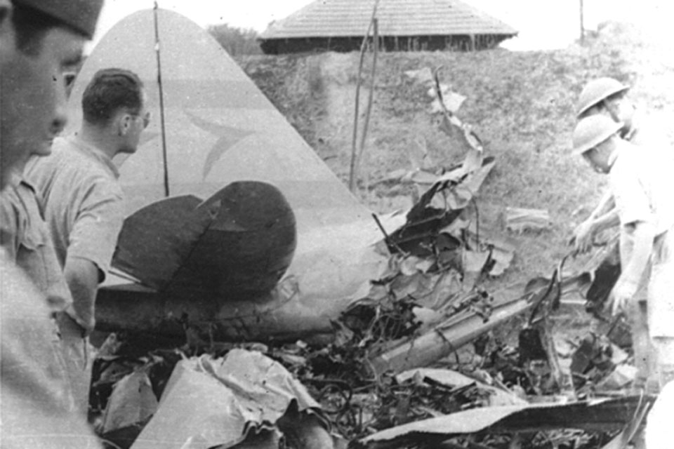 Boyington (wearing sunglasses at left) examines a Nakajima Ki.27 of the 77th Sentai shot down at Mingaladon airfield by a Curtiss P-40C of the American Volunteer Group on January 28, 1942. (Flying Tigers Association)