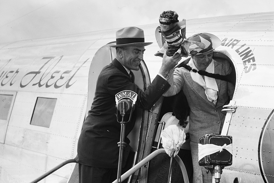 May 17, 1937. First Lady Eleanor Roosevelt and Capt. Eddie Rickenbacker christen The flagship of Eastern Air Lines to inaugurate the companies new route from New York to Washington, DC. (Library of Congress)