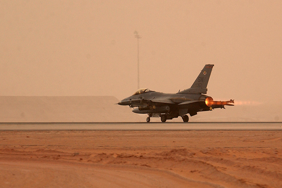 An F-16CJ takes off for a mission during a sand storm. A similar storm posed grave risks for Hampton. (U.S. Air Force photo/SSgt. Matthew Hannen)
