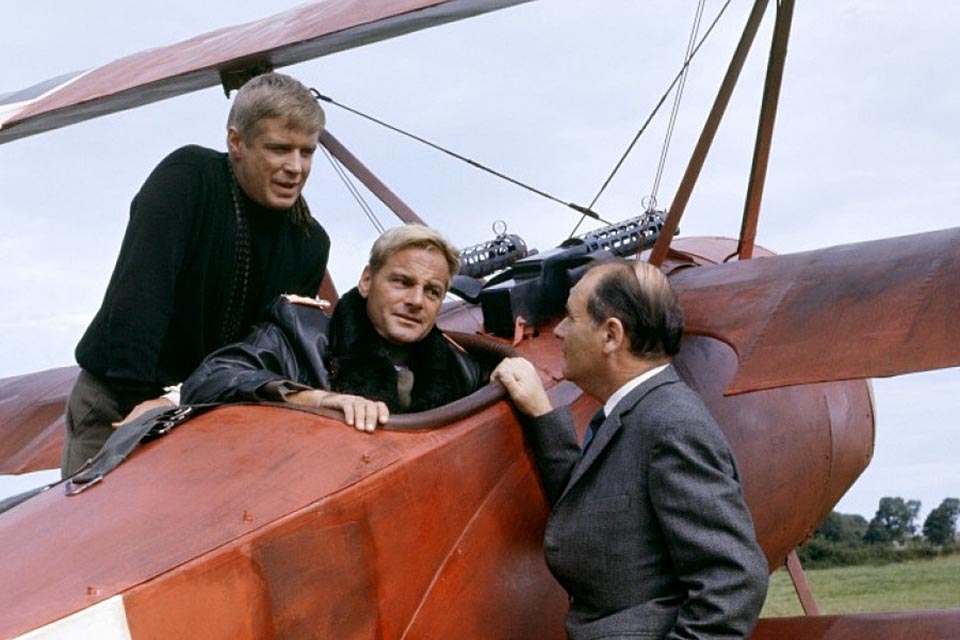 Peppard and Carl Schell confer with a producer. (HistoryNet Archives)