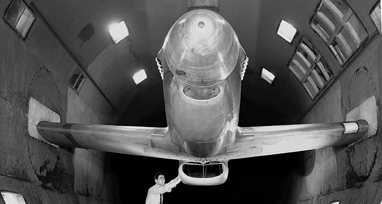 An XP-51B Mustang in the 16-foot wind tunnel at the NACA Ames Aeronautical Laboratory is readied for full-scale studies of duct rumble in March 1943. (NASA)