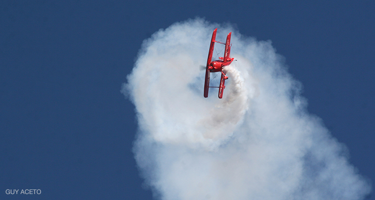 Aerobatic master Sean D. Tucker corkscrews through his performance profile.