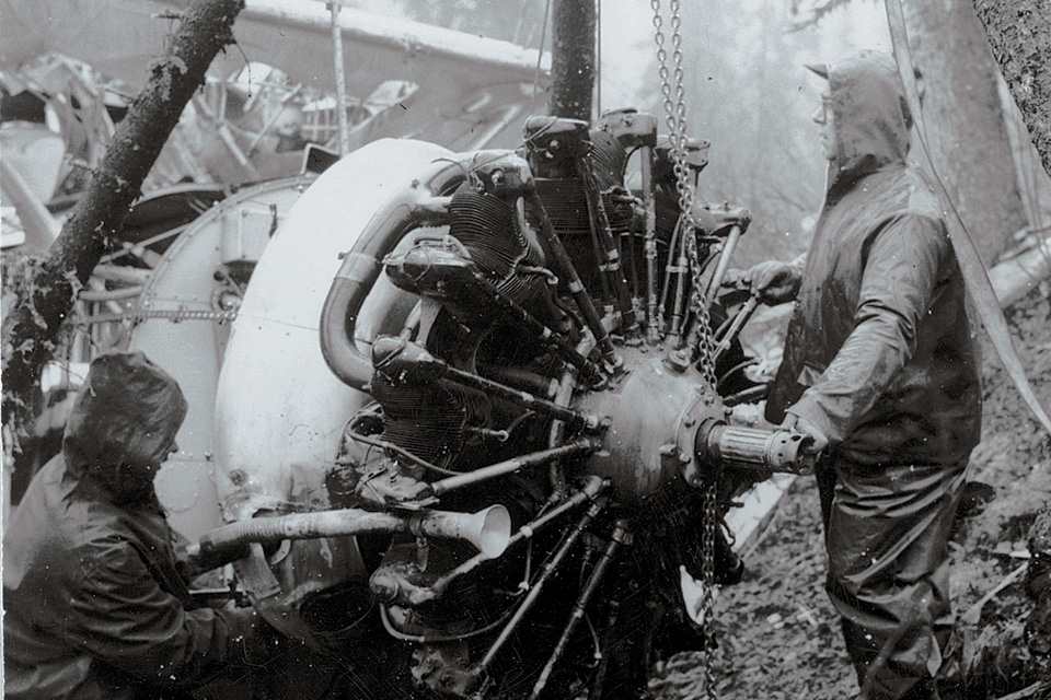 A recovery team begins disassembling the Douglas O-38F’s engine, which was later flown from the crash site via heavy-lift Army helicopter. (National Museum of the U.S. Air Force)