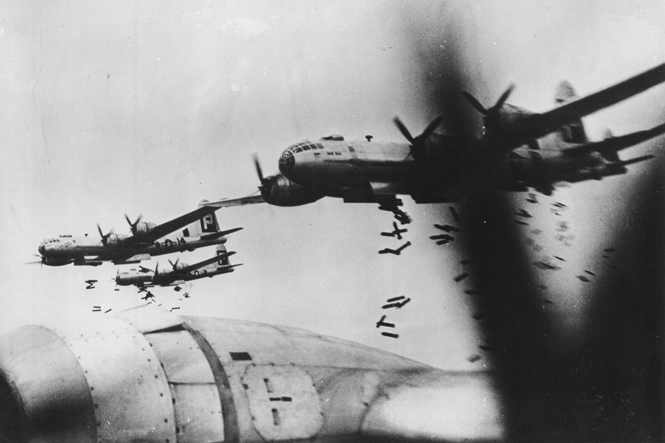 Incendiary bombs tumble from Twentieth Air Force B-29s over Yokohama in May 1945. (National Archives)