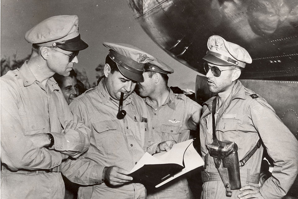 Brig. Gen. Thomas Power (right), senior officer on the March 10 attack on Tokyo by more than 300 B-29s, talks to Maj. Gen. Curtis E. LeMay, XXI Bomber Command commander, and Brig. Gen. Lauris Norstad (left), Twentieth Air Force chief of staff, after returning from the attack, which burned out huge areas of the Japanese capital. (National Archives)