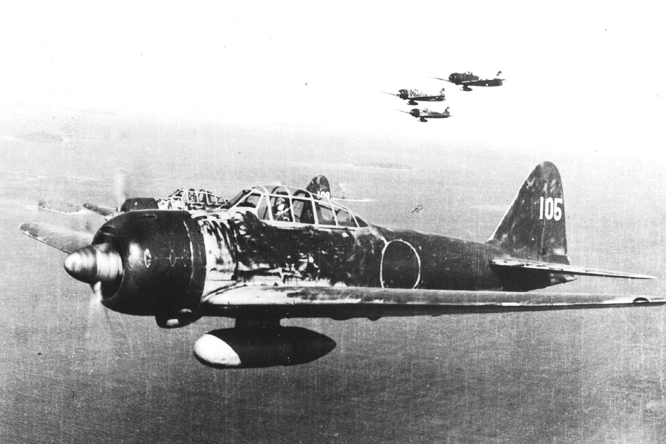 Japanese A6M Zeros like these from the 251 Kokutai based on nearby Rabaul, swarmed Old 666, repeatedly making head-on passes against the B-17’s weak frontal defenses.  (National Archives)