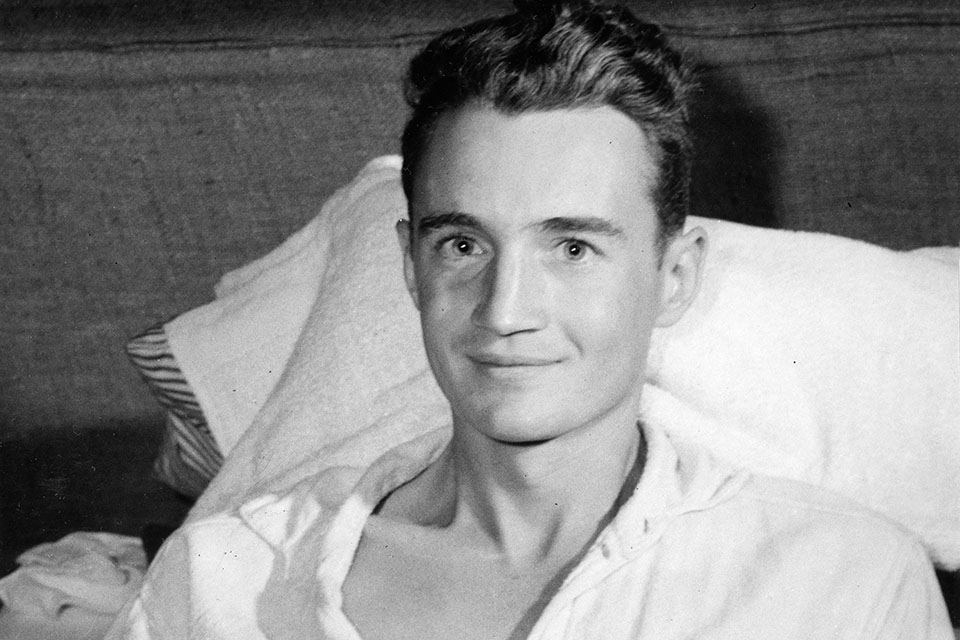 Doctors removed nearly 150 pieces of shrapnel—including chunks of the plane’s rudder pedals and its control cables—from Zeamer’s legs, arms, and torso. For their valor in combat, Zeamer (pictured in the hospital) and bombardier Joe Sarnoski received the Medal of Honor.  (National Archives)