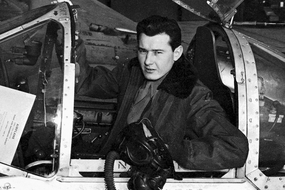 Hoover sits in the cockpit of a Lockheed P-38 Lightning, just one of the many aircraft he mastered during World War II.  (National Archives)