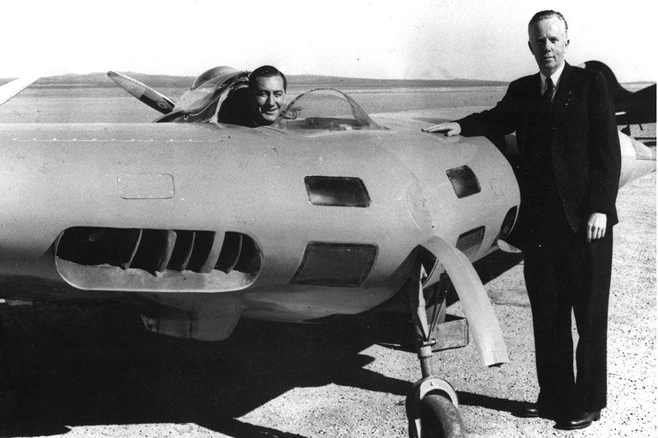 Jack Northrop, next to his N-1M "Jeep," at Muroc Field, circa 1941. In the cockpit of the flying wing is test pilot Moye Stephens. (USAF Flight Test Center Archives)