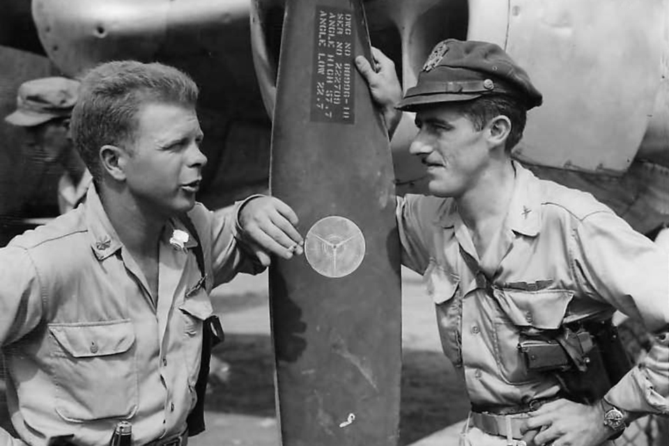 Major Bong (left), now a V Fighter Command staff officer with a “roving commission,” confers with Major Thomas J. McGuire of the 475th Fighter Group, who became a determined rival for Bong’s status as America's top ace. (National Archives)