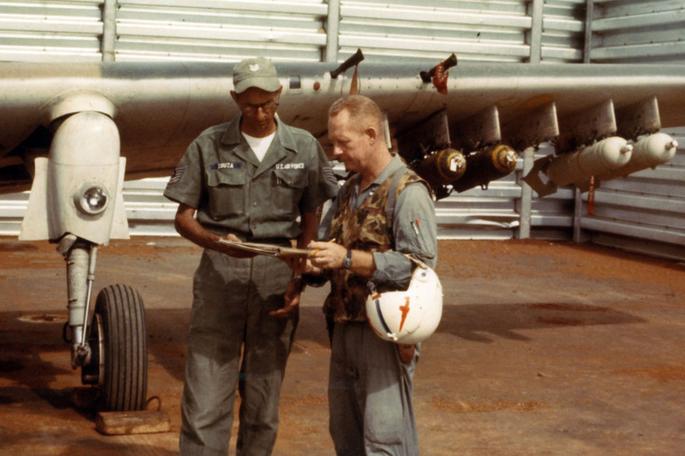 Fisher, (right) checks in with his crew chief, TSgt. Rodney Souza, before another Skyraider sortie, at Pleiku AB, South Vietnam. (U.S. Air Force)