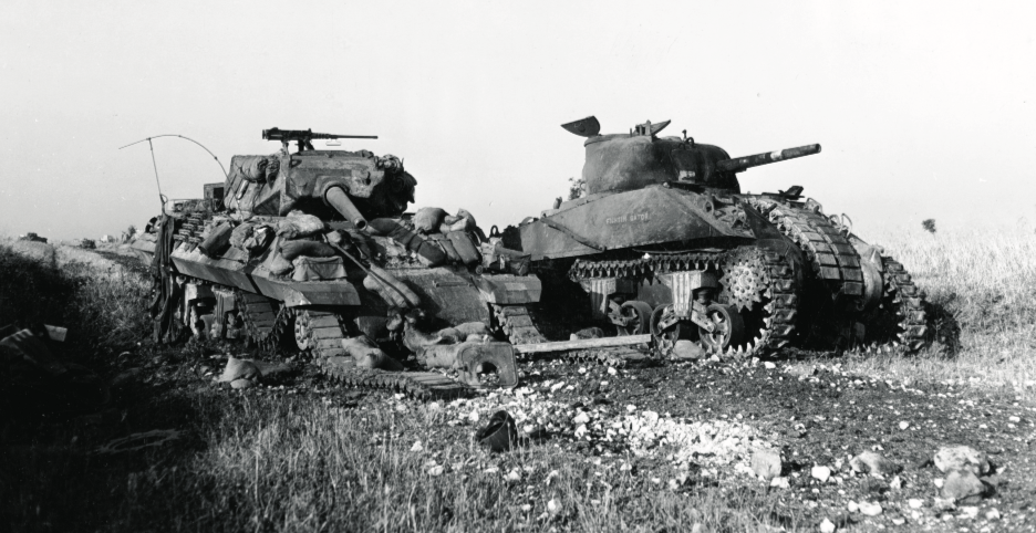 Among the American casualties were an M10 tank destroyer (left) and M4 Sherman, hit near a bridge called the Flyover. (National Archives)