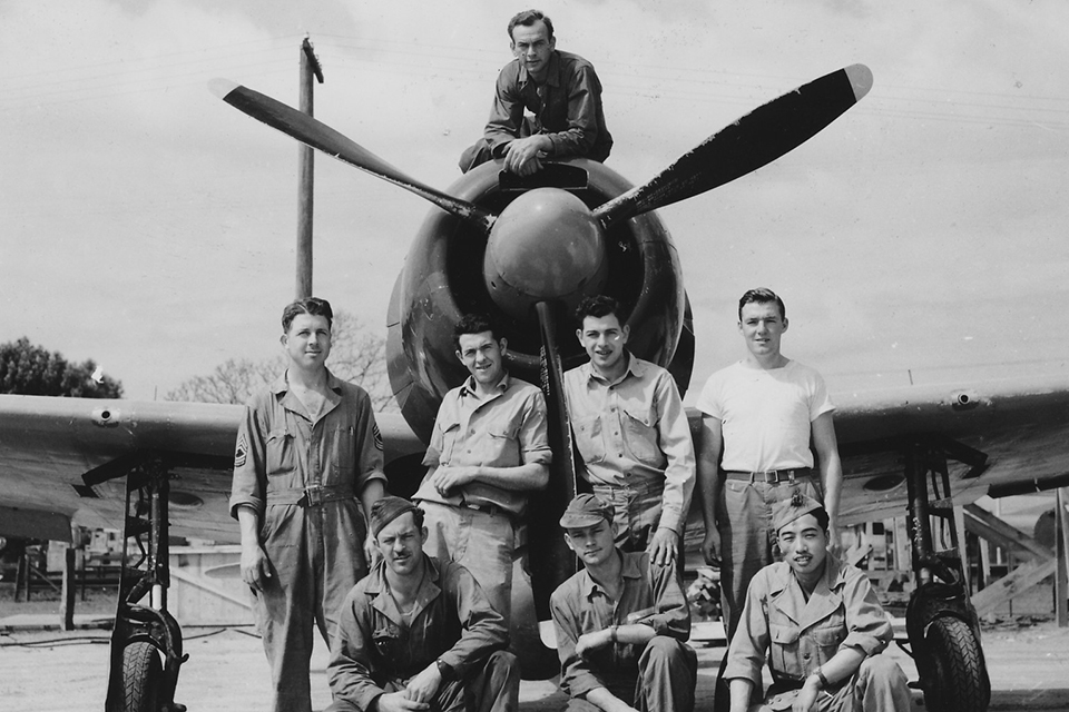 The TAIU hangar crew poses with an A6M3. Originally dubbed Hap, its nickname was changed to Hamp then to Zeke 32 when it was identified as a Zero with clipped wingtips. (Courtesy of Linda Grow)