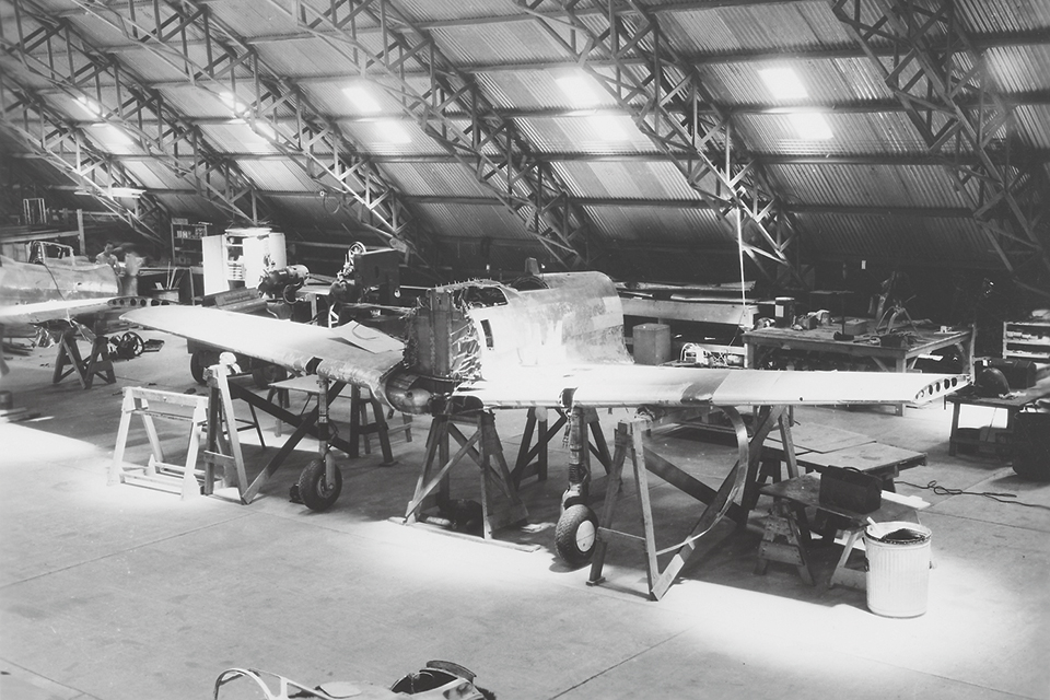 The center section of a Ki.43, discovered at Lae airfield, is reassembled in Hangar 7 at Brisbane. (Courtesy of Linda Grow)