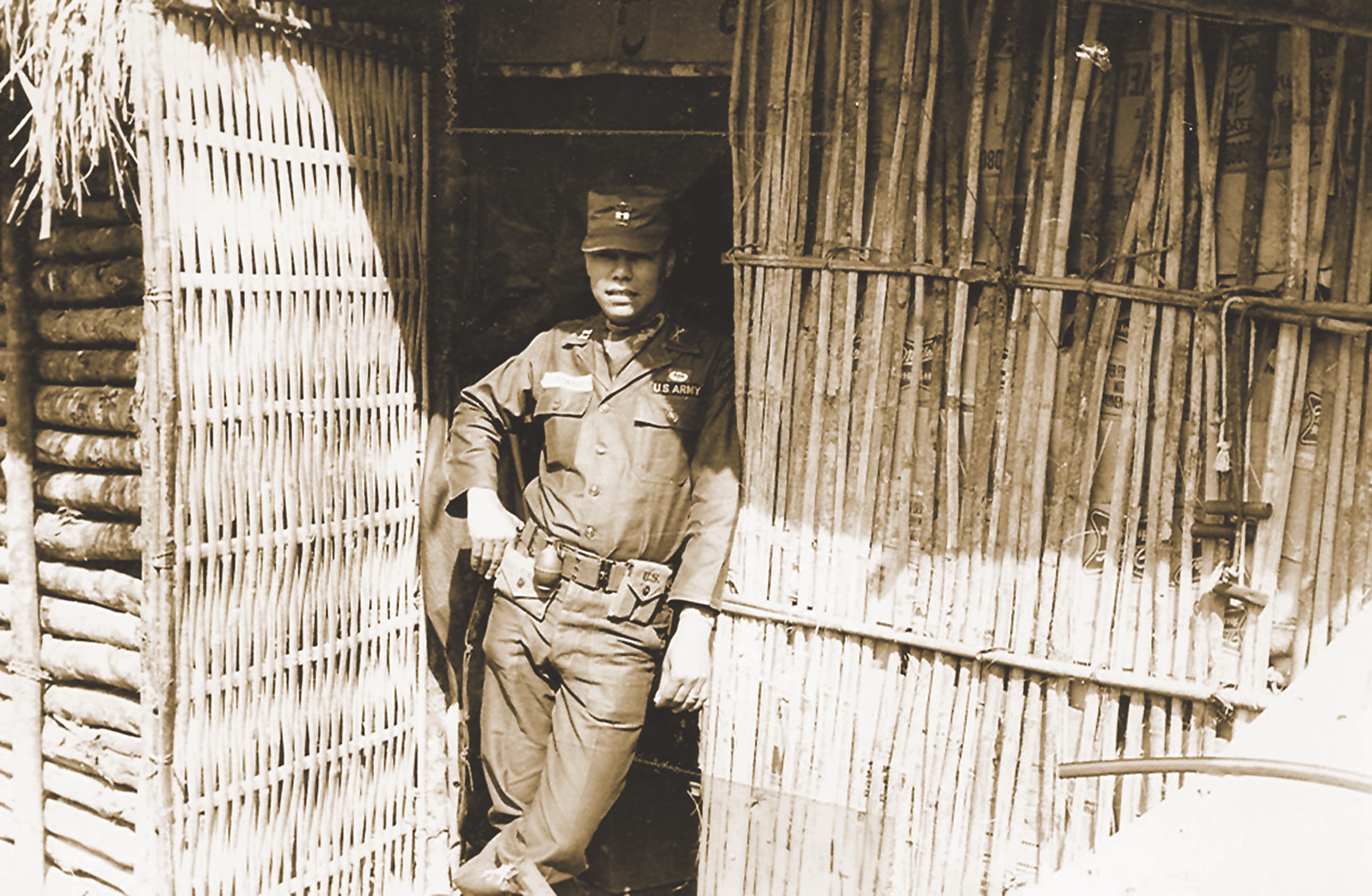 The young captain Colin Powell leans against his hooch in the A Shau Valley in 1963 wearing his “showoff” uniform.On patrol, the name tag and silver bars were gone, and the grenade was carried more carefully. (Courtesy Colin L. Powell)